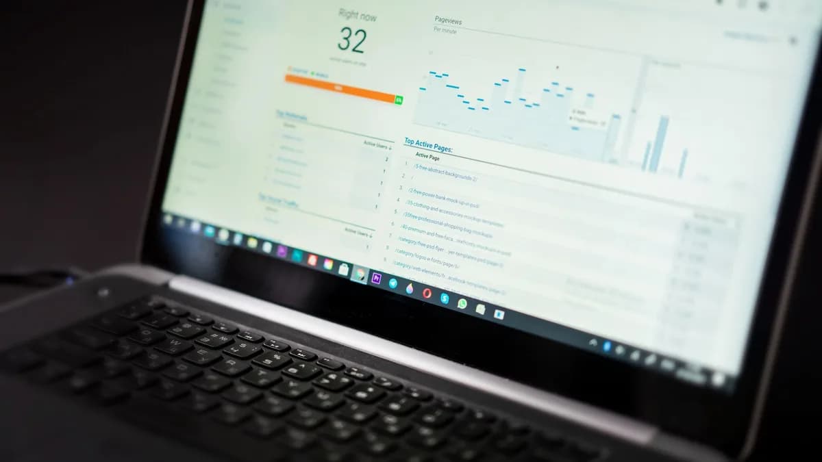 A laptop displaying an analytics dashboard with real-time data tracking and analysis tools.